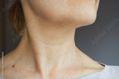 Close-up of mature woman's neck, natural aging concept