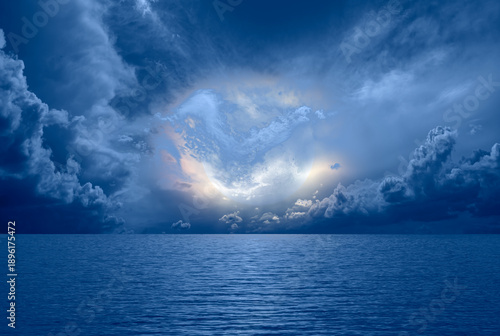 Εκτύπωση καμβά Night sky with full moon in the clouds and reflection in the sea - Deep blue moo