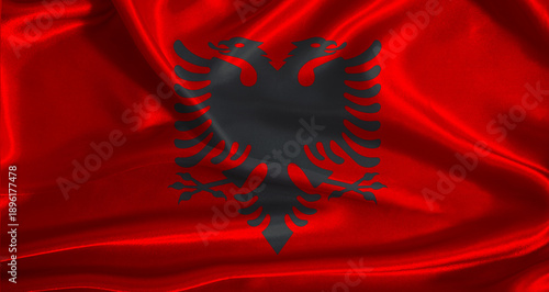 Fotografie Albania flag with cloth textured background