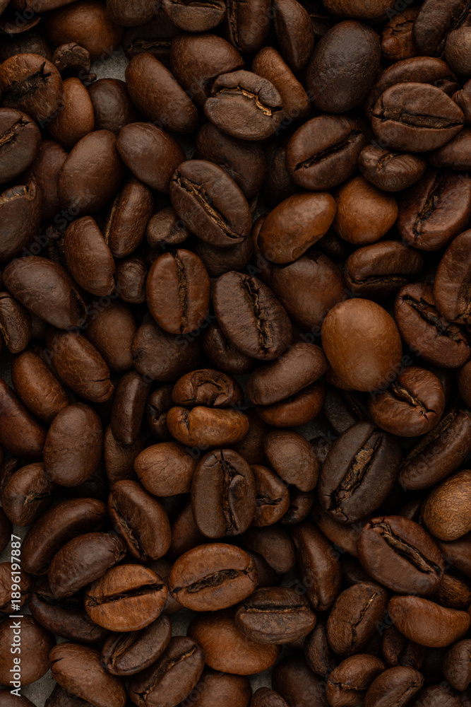 Naklejka premium macro texture of roasted coffee beans