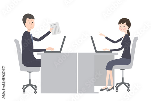 オフィスで仕事をするスーツ姿の男女