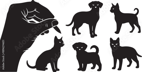 Hand holding finger near black cat and dog silhouettes