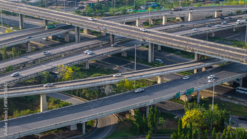 Aerial view city transport junction cross modern road morning light with vehicle movement