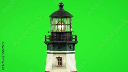 Miniature lighthouse model on green screen background for versatile use