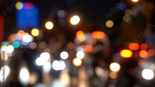 Asia, Vietnam , Ho Chi Minh,  blurred lights of city traffic . Congested traffic of cars and scooters on the streets of Saigon night  - Air pollution PM10 and fine particles above the permitted thresh