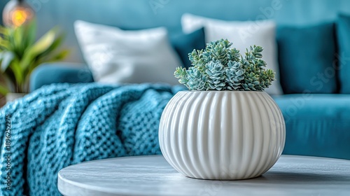 Wallpaper Mural Succulent plant in white pot on table in blue living room Torontodigital.ca