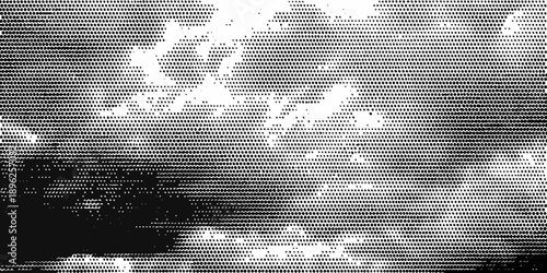 Abstract grayscale image depicting a cloudy sky and silhouetted trees