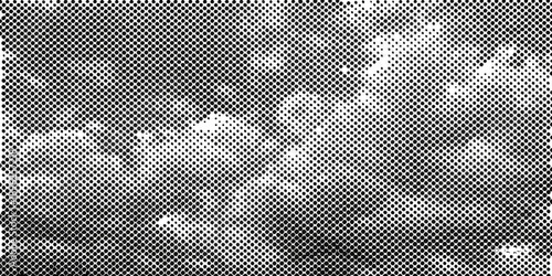 A grainy black and white image depicting clouds and faint stars