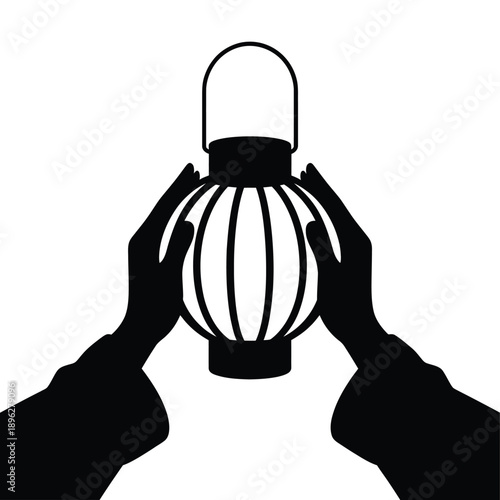 Hands cradling a traditional paper lantern in a black and white silhouette