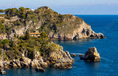 Panoramic view of Capo Taormina cape with Isola Bella island on Ionian sea shore in Messina region of Sicily in Italy