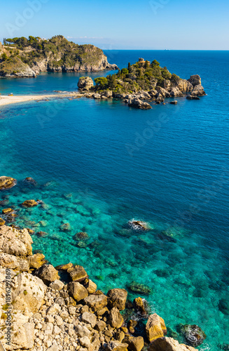 Panoramic view of Capo Taormina cape with Isola Bella island on Ionian sea shore in Messina region of Sicily in Italy