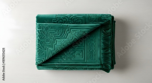 Wallpaper Mural Folded green textile with decorative pattern on white surface Torontodigital.ca