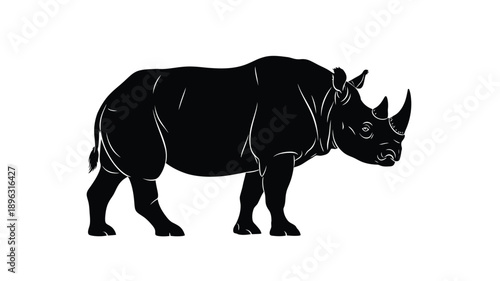 a striking black silhouette of a rhinoceros standing on a white background