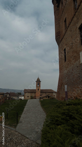view of the small village of grinzane cavour frome the castle hill in piedmont, italy