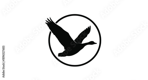 A black silhouette of a goose in flight enclosed within a circular frame
