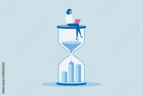 A woman working on a laptop perched atop an hourglass time management concept