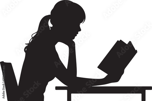 Silhouette of a woman reading a book at a desk