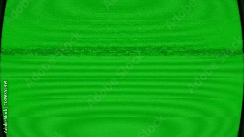 Green screen television display with dark border for visual effects