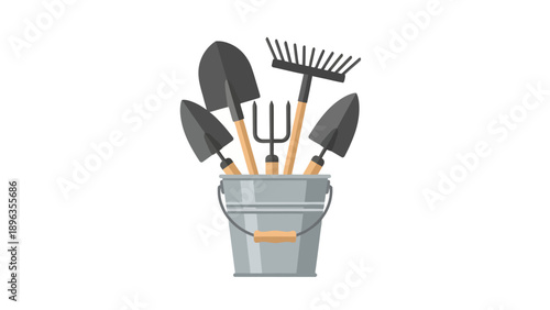 Gardening tools in a metal bucket