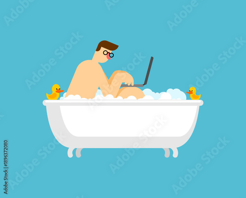 man with glasses working on a laptop while relaxing in a bathtub filled with bubbles. Concept of freelance work, remote office, and digital nomad lifestyle on a blue background