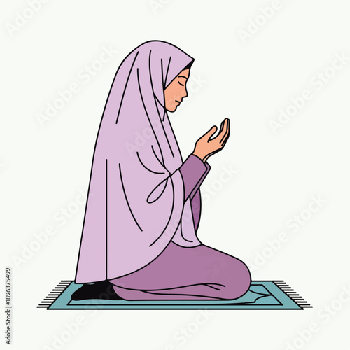 woman in hijab praying on prayer mat in islamic religious ritual