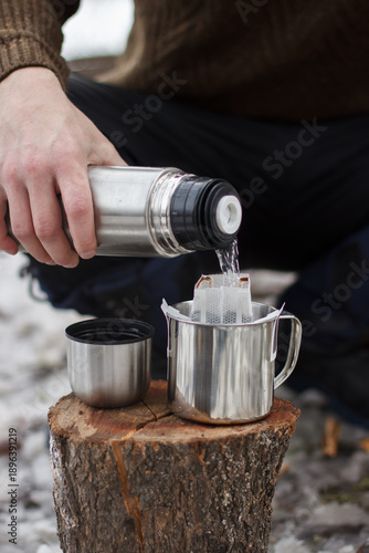 Brewing coffee outdoors. Making drip coffee