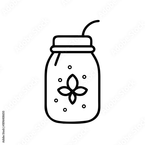 Glass jar with drink and straw featuring floral design  