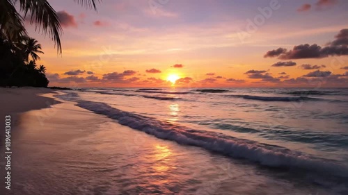 Tranquil beach sunset scene with palm trees and ocean waves