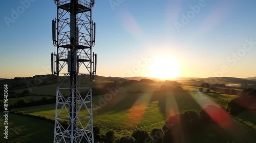 Wallpaper Mural Cell tower at sunset in rural countryside with sun rays beaming through the structure Torontodigital.ca