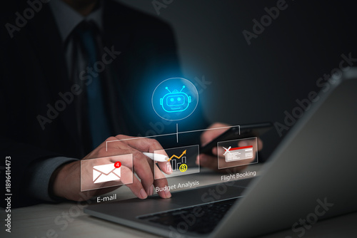 Businessman using laptop and smartphone with AI Chatbot assistant managing email, budget analysis, and flight booking. Concept of workflow automation and virtual secretary technology.