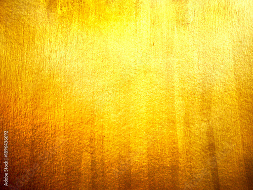 Golden texture background with shiny metallic foil surface glinting yellow light luxury elegant abstract backdrop for holiday celebration design
