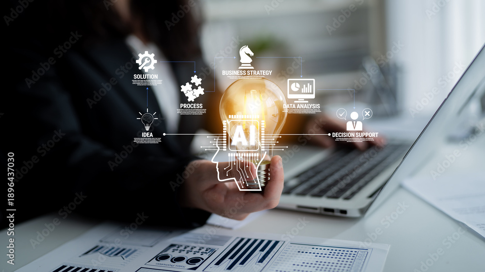 Fototapeta premium Business professional holding glowing light bulb with digital icons representing strategy, data analysis, decision support, and innovative ideas concept Quark.