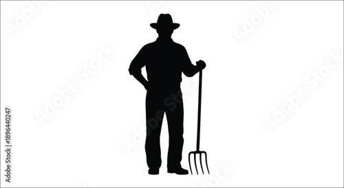 A farmer stands with a pitchfork depicted as a dark silhouette