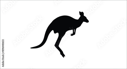 A black kangaroo mid jump a striking animal form silhouette