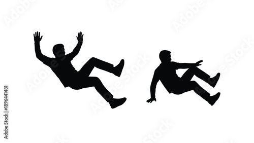 Two figures falling dynamically capturing a sense of motion silhouette