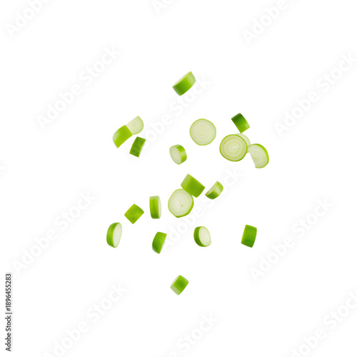Fresh Cucumber Pieces Falling on White Surface in Kitchen for Cooking Salad o...