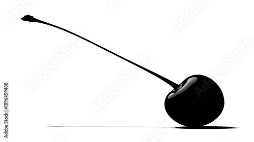A single, glossy black cherry with stem and a hint of red atop it, casting a shadow