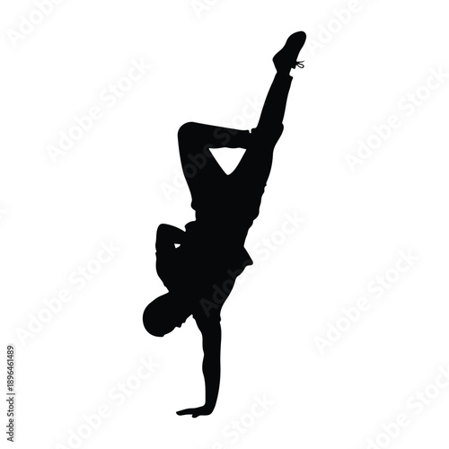 Black silhouette of a male breakdancer performing an athletic handstand move