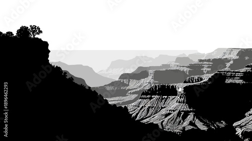 Black and white landscape of mountains and canyon walls with varying shades of gray