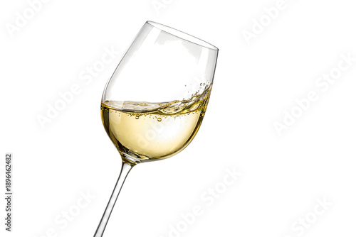 A tilted wine glass with white wine on transparent background