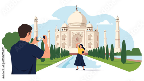 Tourist takes a photo of his female partner posing in front of the iconic Taj Mahal monument in India under a clear blue sky.