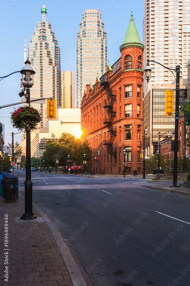 Fototapeta premium Gooderham Building flatiron architecture at street intersection in downtown Toronto city center during daylight