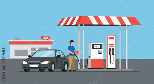 Red and blue emergency lights from a police car and ambulance illuminate a city gas station at night as a white transport truck passes traffic signs on the road