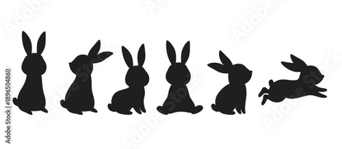 Easter bunny rabbit silhouette vector illustration bundle featuring six black rabbit shapes. Includes sitting, standing, and jumping rabbits, along with carrots, flowers, and an Easter egg. © JungleOutThere