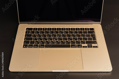 Closeup view of a laptop keyboard featuring Cyrillic characters, highlighting technology and typography details