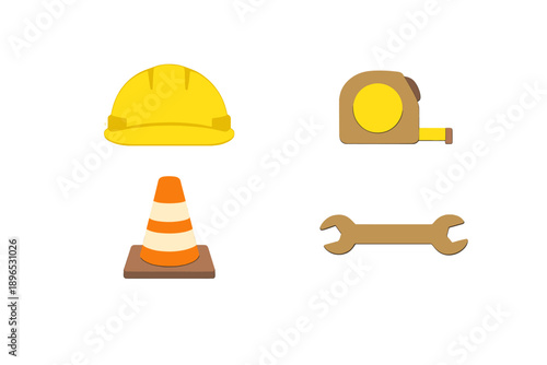 Construction tools and safety items lie on a flat surface ready for work to begin at a building site in the afternoon light