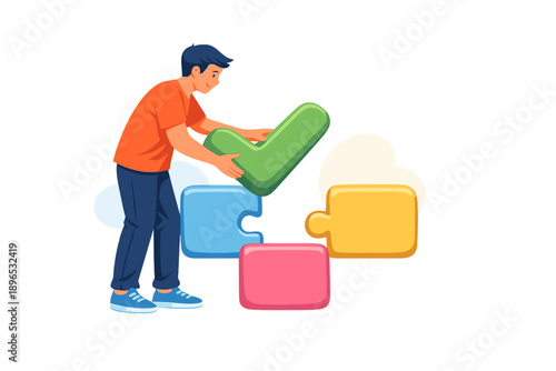 Boy places green puzzle piece into colorful puzzle blocks at a workspace during day time