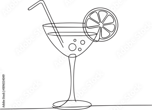 A refreshing cocktail in a martini glass with a slice of citrus on the rim and a straw, viewed from the side on a simple surface