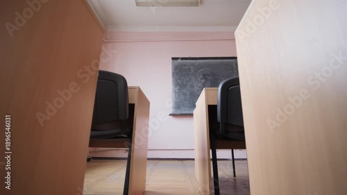 Camera Moves Between Rows Of Desks In Empty Classroom