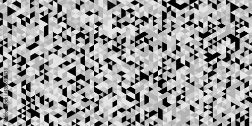 Abstract geometric pattern composed of interlocking triangles shapes, rendered in a monochrome black, white, and gray palette, the design features sharp angles modern, minimalist background.